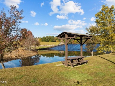 Welcome home to a beautifully maintained 3-bedroom home offering on River Golf and County Club at Lake Royale in North Carolina - for sale on GolfHomes.com, golf home, golf lot