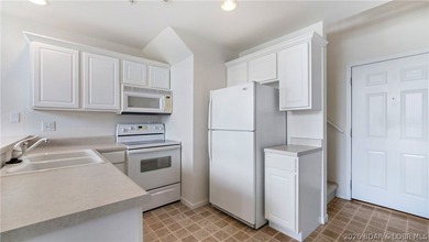 Discover this top-floor 3-bedroom, 3-bathroom condo with a on The Club At Old Kinderhook in Missouri - for sale on GolfHomes.com, golf home, golf lot