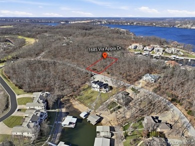 Exceptional vacant lot with beautiful direct water views located on The Club At Porto Cima in Missouri - for sale on GolfHomes.com, golf home, golf lot