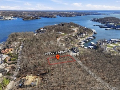 Exceptional vacant lot with beautiful direct water views located on The Club At Porto Cima in Missouri - for sale on GolfHomes.com, golf home, golf lot