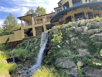 Exceptional vacant lot with beautiful direct water views located on The Club At Porto Cima in Missouri - for sale on GolfHomes.com, golf home, golf lot