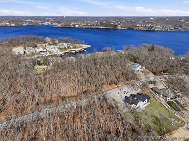 Exceptional vacant lot with beautiful direct water views located on The Club At Porto Cima in Missouri - for sale on GolfHomes.com, golf home, golf lot