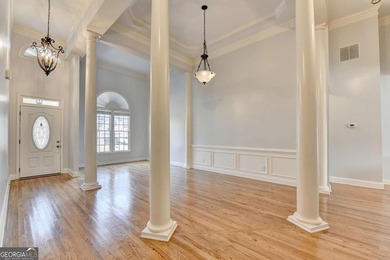 Welcome Home to this beautiful, easy-living residence perfectly on Hampton Golf Village in Georgia - for sale on GolfHomes.com, golf home, golf lot