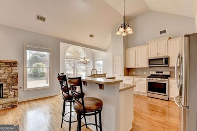 Welcome Home to this beautiful, easy-living residence perfectly on Hampton Golf Village in Georgia - for sale on GolfHomes.com, golf home, golf lot