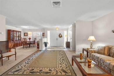 Welcome to this beautifully maintained waterfront home located on Jacaranda West Country Club in Florida - for sale on GolfHomes.com, golf home, golf lot