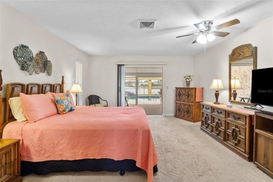 Welcome to this beautifully maintained waterfront home located on Jacaranda West Country Club in Florida - for sale on GolfHomes.com, golf home, golf lot