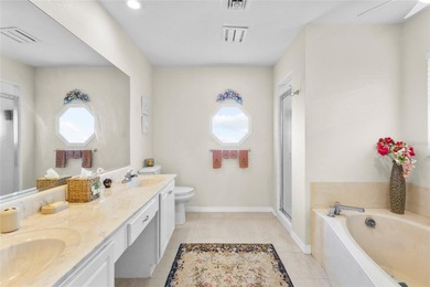 Welcome to this beautifully maintained waterfront home located on Jacaranda West Country Club in Florida - for sale on GolfHomes.com, golf home, golf lot