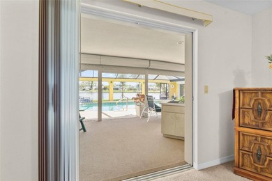 Welcome to this beautifully maintained waterfront home located on Jacaranda West Country Club in Florida - for sale on GolfHomes.com, golf home, golf lot