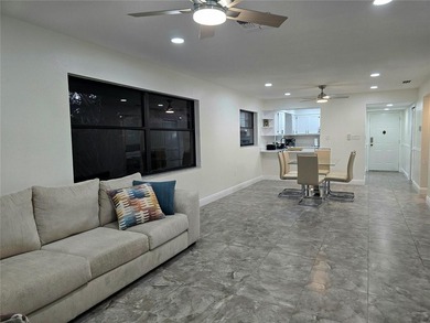 Enjoy Florida's lifestyle at its best in this renovated top on Countryside Country Club in Florida - for sale on GolfHomes.com, golf home, golf lot