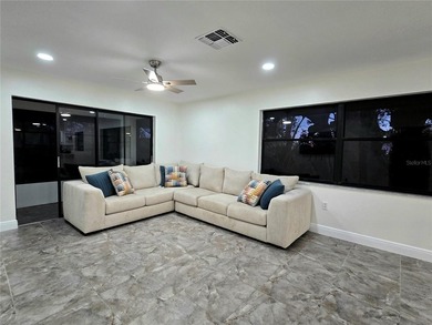 Enjoy Florida's lifestyle at its best in this renovated top on Countryside Country Club in Florida - for sale on GolfHomes.com, golf home, golf lot