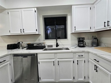 Enjoy Florida's lifestyle at its best in this renovated top on Countryside Country Club in Florida - for sale on GolfHomes.com, golf home, golf lot