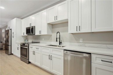 This completely renovated home sits directly on the golf course on Indian River Club in Florida - for sale on GolfHomes.com, golf home, golf lot