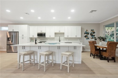 This completely renovated home sits directly on the golf course on Indian River Club in Florida - for sale on GolfHomes.com, golf home, golf lot