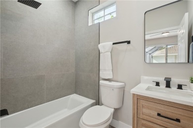 This completely renovated home sits directly on the golf course on Indian River Club in Florida - for sale on GolfHomes.com, golf home, golf lot