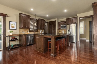 This 2-story home in Chapel Hill sits on a large cul-de-sac lot on Heritage Park Golf Course in Kansas - for sale on GolfHomes.com, golf home, golf lot