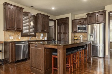 This 2-story home in Chapel Hill sits on a large cul-de-sac lot on Heritage Park Golf Course in Kansas - for sale on GolfHomes.com, golf home, golf lot