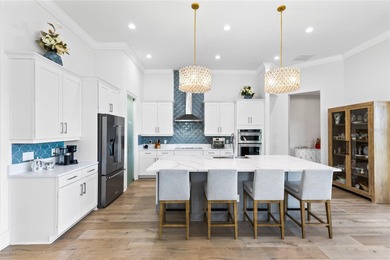 Gated golf course living with panoramic water views in Eagle on Eagle Creek Golf Club in Florida - for sale on GolfHomes.com, golf home, golf lot