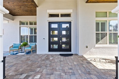 Gated golf course living with panoramic water views in Eagle on Eagle Creek Golf Club in Florida - for sale on GolfHomes.com, golf home, golf lot