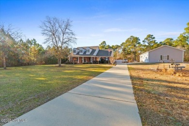 Welcome to your private paradise, perfectly positioned halfway on Carolina National Golf Club in North Carolina - for sale on GolfHomes.com, golf home, golf lot