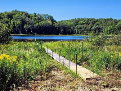 This South-facing lake lot is situated on Upper Waterman, the on Cumberland Golf Club in Wisconsin - for sale on GolfHomes.com, golf home, golf lot