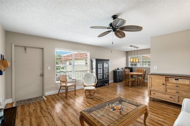 This charming partially furnished 2BR/2BA condo in Vista Royale on The American Golf Club in Florida - for sale on GolfHomes.com, golf home, golf lot