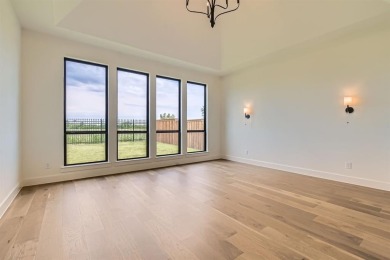 Experience luxury living in a picturesque location! This custom on The Tribute At the Colony in Texas - for sale on GolfHomes.com, golf home, golf lot