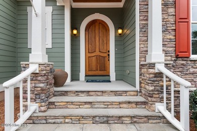 Panoramic water and golf course views set the stage for this on Ocean Ridge Plantation in North Carolina - for sale on GolfHomes.com, golf home, golf lot