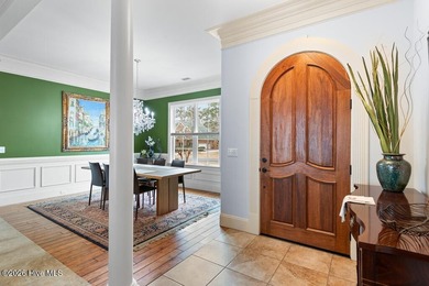 Panoramic water and golf course views set the stage for this on Ocean Ridge Plantation in North Carolina - for sale on GolfHomes.com, golf home, golf lot