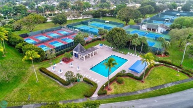 EXTRA LARGE 1568 SQ/FT TASTEFULLY RENOVATED CORNER UNIT WITH on Wynmoor Golf Course in Florida - for sale on GolfHomes.com, golf home, golf lot