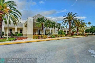 EXTRA LARGE 1568 SQ/FT TASTEFULLY RENOVATED CORNER UNIT WITH on Wynmoor Golf Course in Florida - for sale on GolfHomes.com, golf home, golf lot