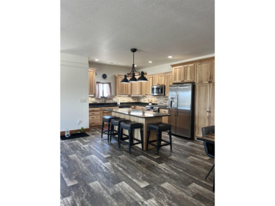 Listed by Lonnie Doney, KWBH, . Nestled in Boulder Falls on Southern Hills Golf Course in South Dakota - for sale on GolfHomes.com, golf home, golf lot