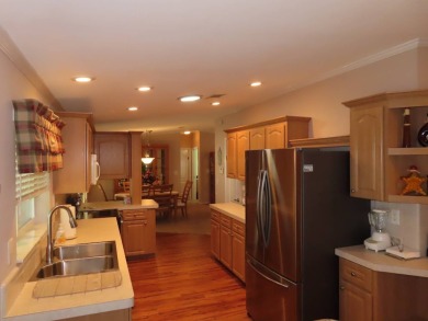 This move in ready 1605 sf split 3/2 home is offered for $169 on Crane Lakes Golf and Country Club in Florida - for sale on GolfHomes.com, golf home, golf lot