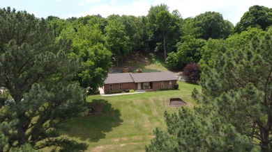 Nestled among impressive oaks and pines this beautifully on Oakridge Golf Course in Arkansas - for sale on GolfHomes.com, golf home, golf lot