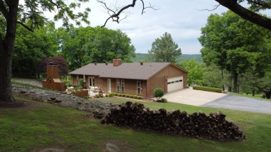 Nestled among impressive oaks and pines this beautifully on Oakridge Golf Course in Arkansas - for sale on GolfHomes.com, golf home, golf lot