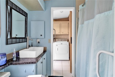 Live the dream in this beautifully updated 2BR/2BA home in on Barefoot Bay Golf Course in Florida - for sale on GolfHomes.com, golf home, golf lot
