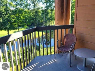 This second-floor Lodge suite offers picturesque views of both on Cedar River Golf Course in Michigan - for sale on GolfHomes.com, golf home, golf lot