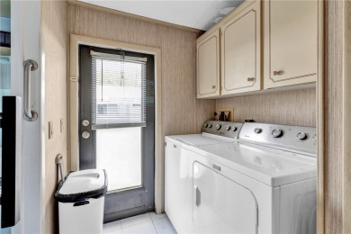 Live the dream in this beautifully updated 2BR/2BA home in on Barefoot Bay Golf Course in Florida - for sale on GolfHomes.com, golf home, golf lot
