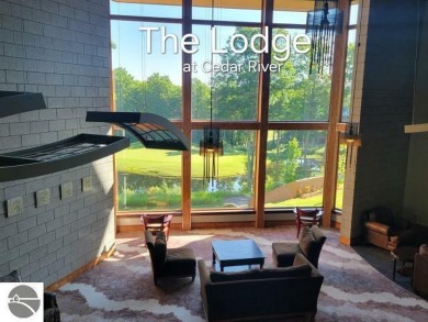 This second-floor Lodge suite offers picturesque views of both on Cedar River Golf Course in Michigan - for sale on GolfHomes.com, golf home, golf lot