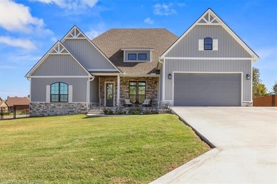 This stunning 4-bedroom, 2-bath home blends modern design with on Wolf Ridge Golf Course in Oklahoma - for sale on GolfHomes.com, golf home, golf lot