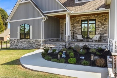 This stunning 4-bedroom, 2-bath home blends modern design with on Wolf Ridge Golf Course in Oklahoma - for sale on GolfHomes.com, golf home, golf lot