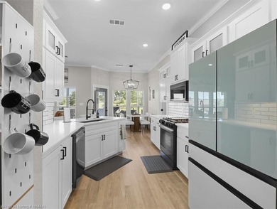 This stunning 4-bedroom, 2-bath home blends modern design with on Wolf Ridge Golf Course in Oklahoma - for sale on GolfHomes.com, golf home, golf lot