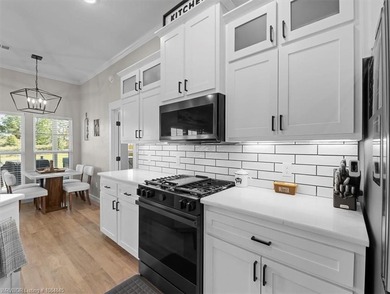 This stunning 4-bedroom, 2-bath home blends modern design with on Wolf Ridge Golf Course in Oklahoma - for sale on GolfHomes.com, golf home, golf lot