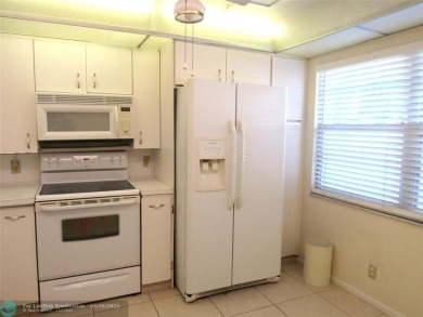 REDUCED! PRICED TO INVEST & FLIP OR TAKE ADVANTAGE OF A BLANK on Wynmoor Golf Course in Florida - for sale on GolfHomes.com, golf home, golf lot