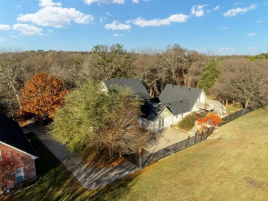 Discover luxury living in this expansive five-bedroom home on White Bluff Resort - Old Course in Texas - for sale on GolfHomes.com, golf home, golf lot