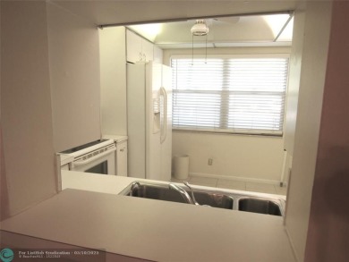 REDUCED! PRICED TO INVEST & FLIP OR TAKE ADVANTAGE OF A BLANK on Wynmoor Golf Course in Florida - for sale on GolfHomes.com, golf home, golf lot