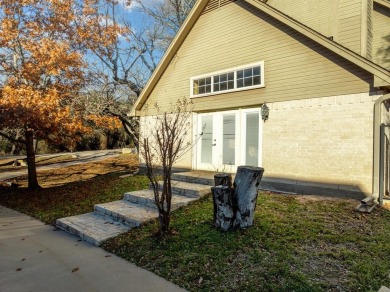 Discover luxury living in this expansive five-bedroom home on White Bluff Resort - Old Course in Texas - for sale on GolfHomes.com, golf home, golf lot