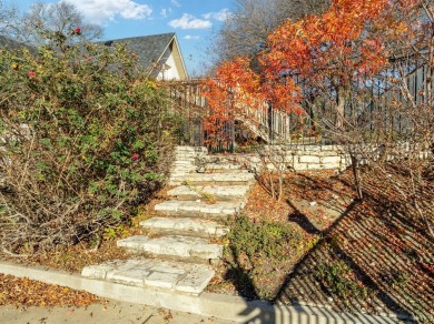 Discover luxury living in this expansive five-bedroom home on White Bluff Resort - Old Course in Texas - for sale on GolfHomes.com, golf home, golf lot