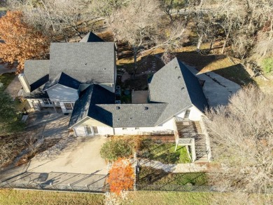 Discover luxury living in this expansive five-bedroom home on White Bluff Resort - Old Course in Texas - for sale on GolfHomes.com, golf home, golf lot