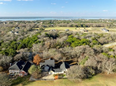 Discover luxury living in this expansive five-bedroom home on White Bluff Resort - Old Course in Texas - for sale on GolfHomes.com, golf home, golf lot