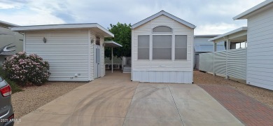 Park model with a separate shed that includes a Roper/Whirlpool on Great Eagle Golf Club in Arizona - for sale on GolfHomes.com, golf home, golf lot
